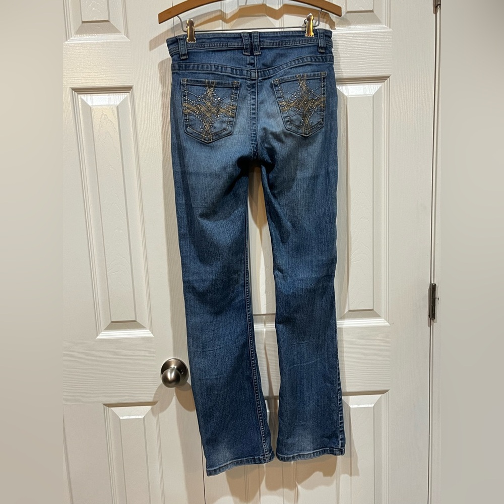 Low rise bell bottom jeans with gems on the back